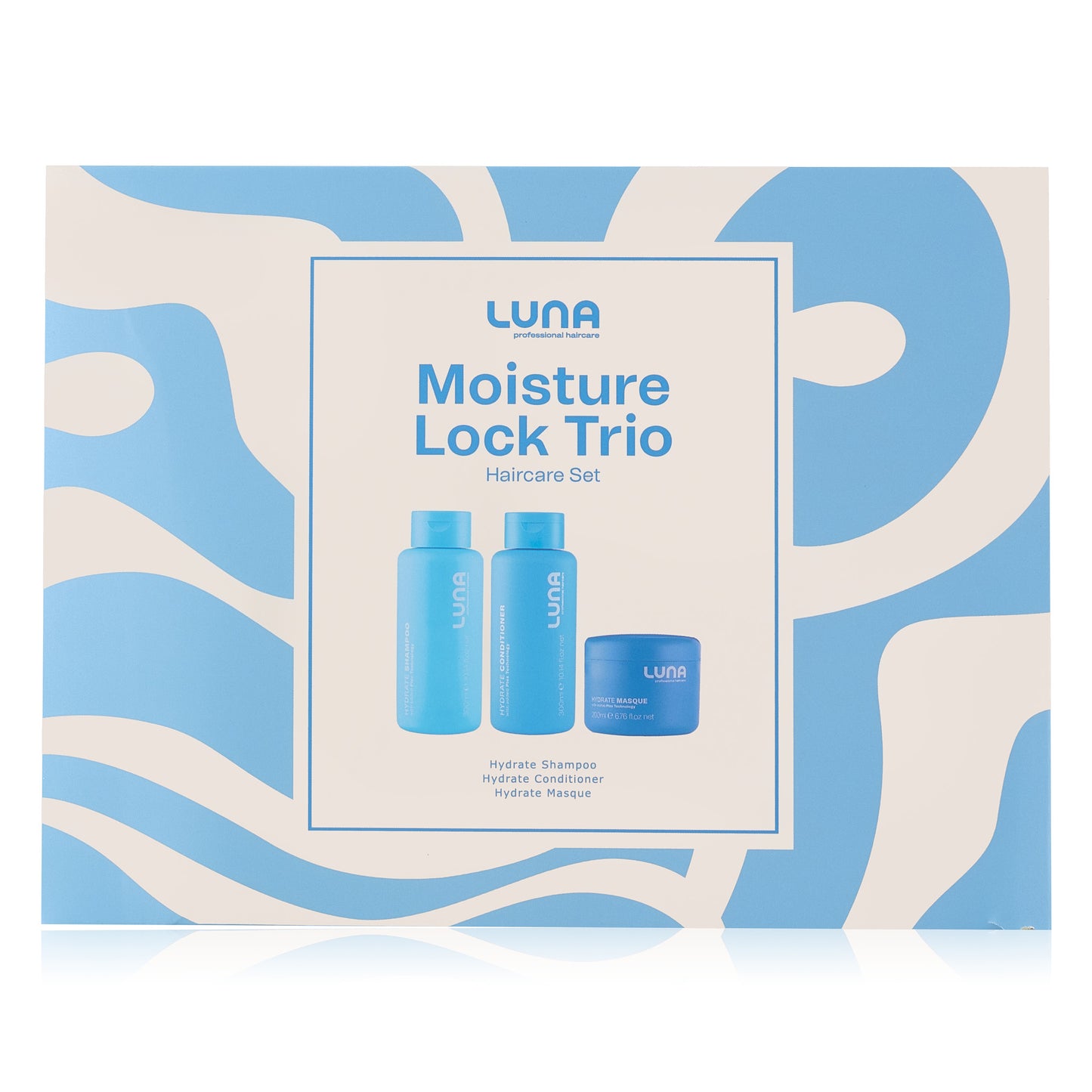 Luna Moisture Lock Trio haircare set packaging on a blue and white abstract background - holiday gift set 2025 - hydrate shampoo, hydrate conditioner and hydrate masque
